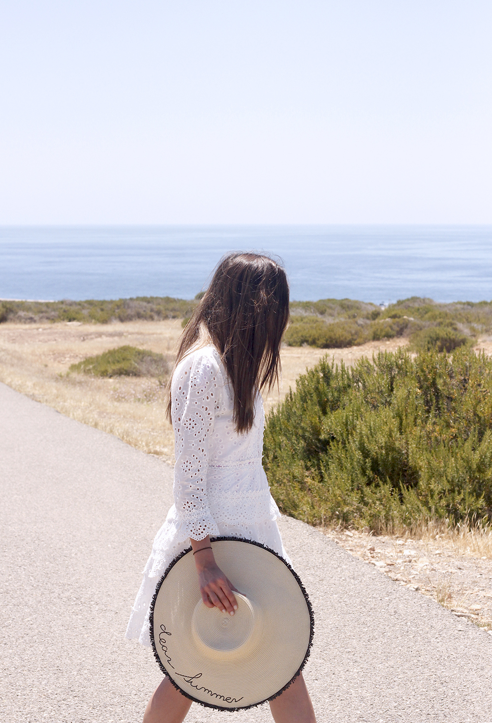 white embroidered dress straw hat striped swimsuit beach formentera street style outfit 20194