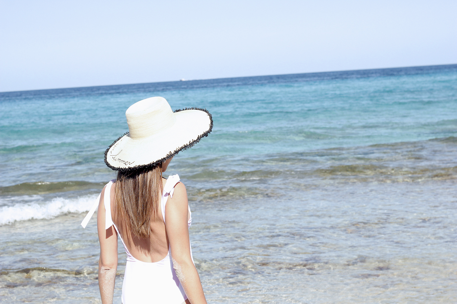 white embroidered dress straw hat striped swimsuit beach formentera street style outfit 201918