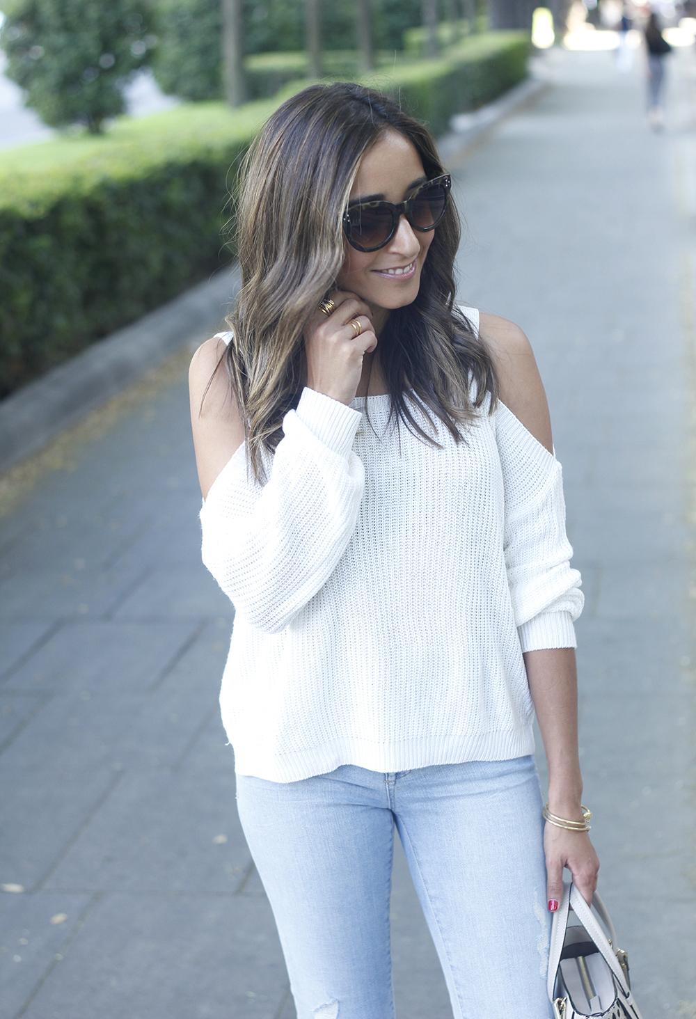 White off the shoulder sweater jeans acosta bag heels outfit style22