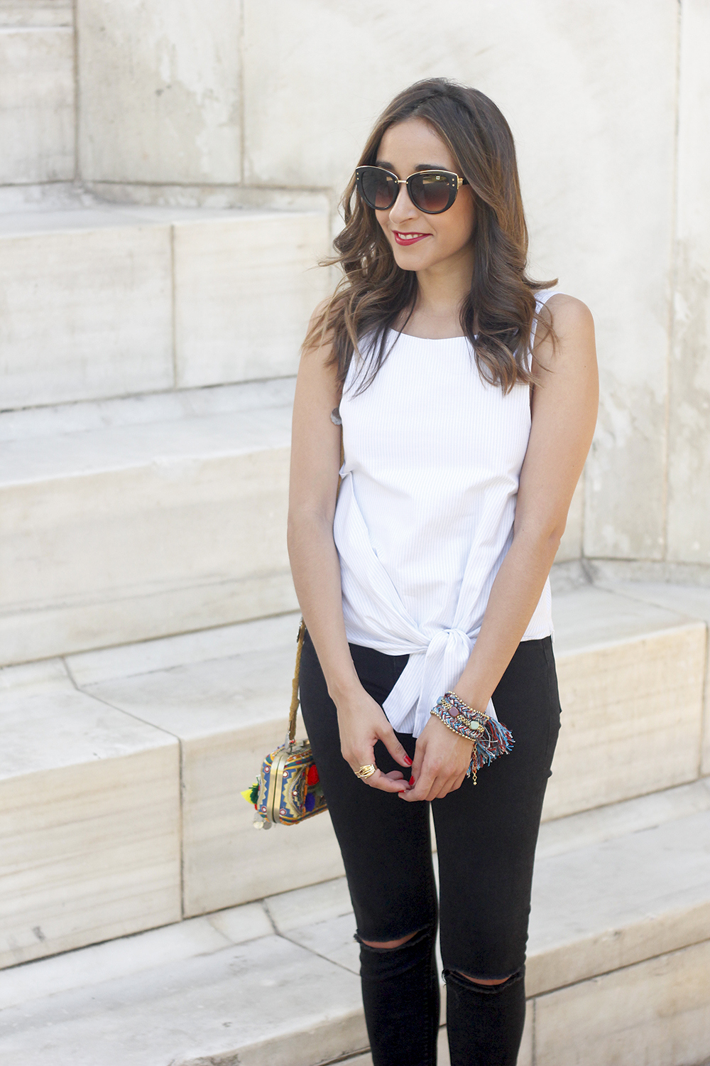 Knotted top black ripped jeans heels clutch sunnies summer outfit13